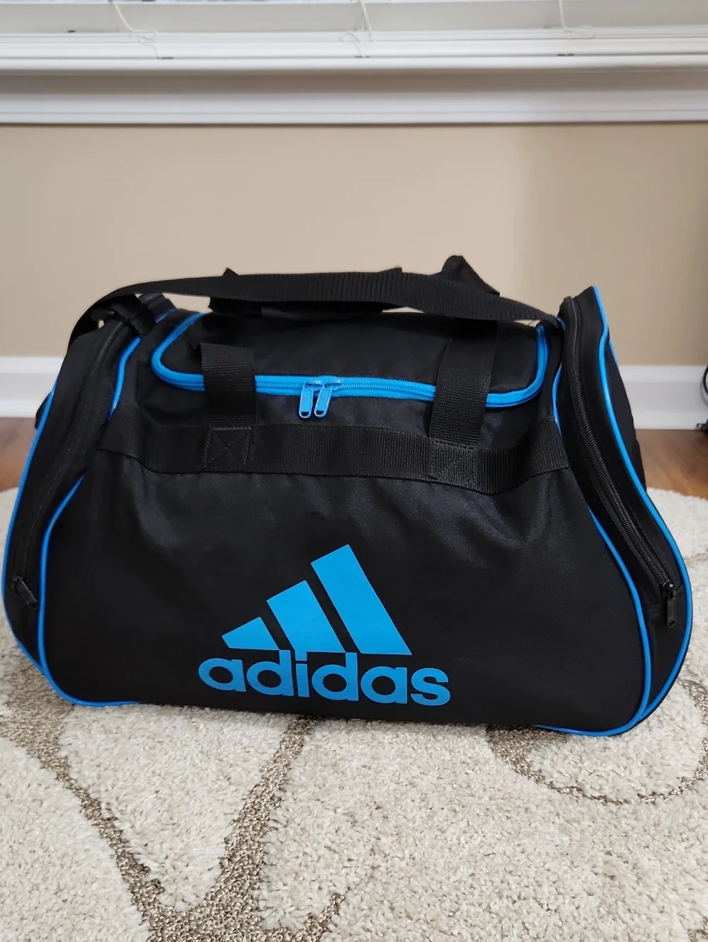 Adidas Black Duffel Bag with Bright Blue Accents